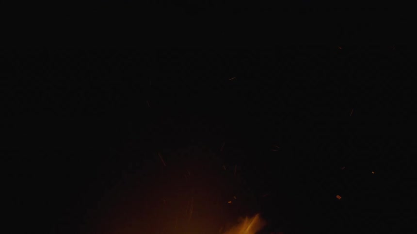 A campfire made of logs burning in the night