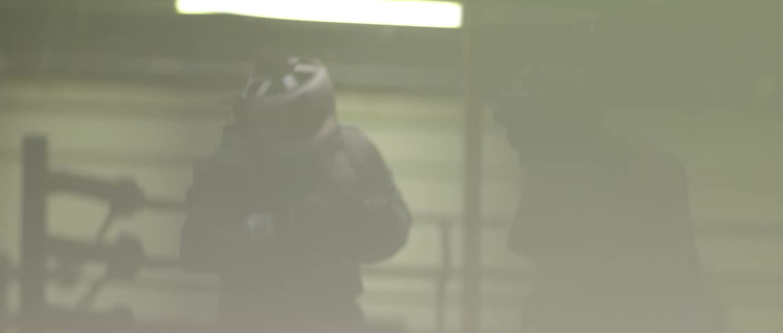 Two men in a boxing rings sparring