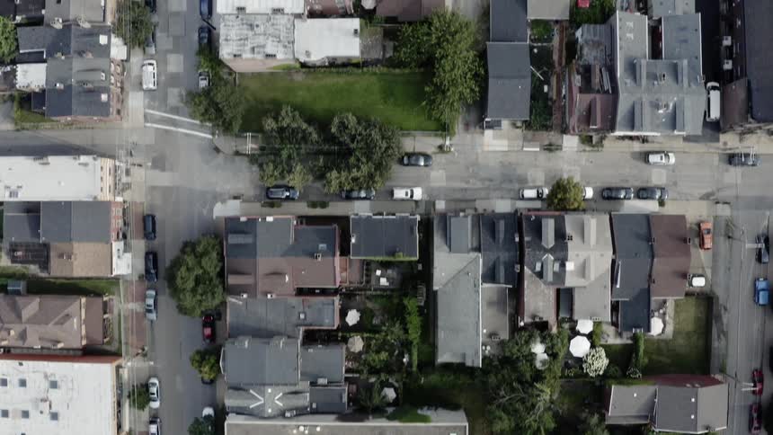 A rundown neighborhood with streets houses and apartment buildings