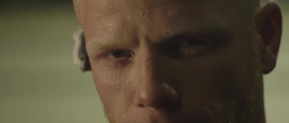 A man opens his eyes and looks ahead