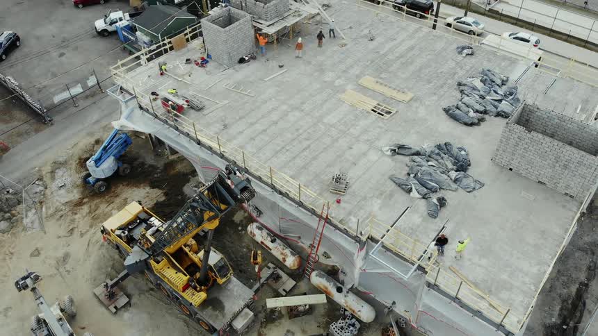 A construction crew works on a building