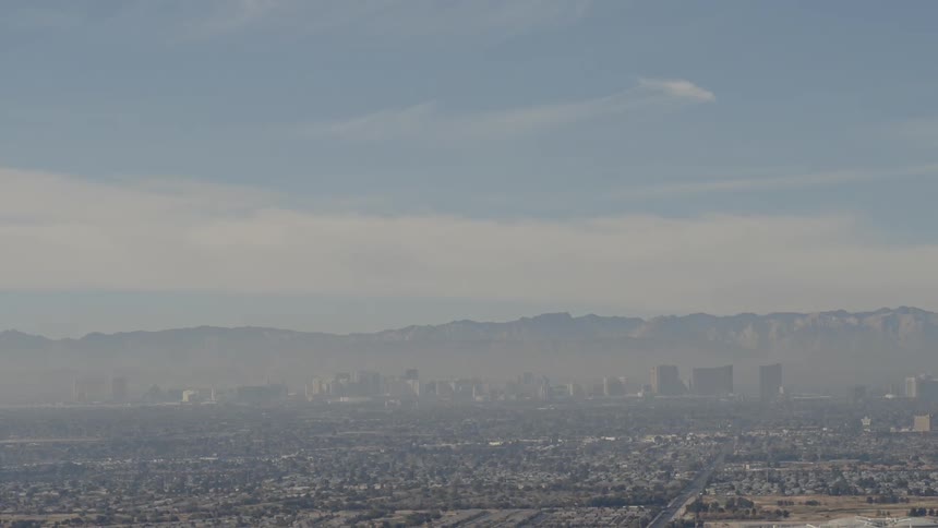 Smog hangs over a large city