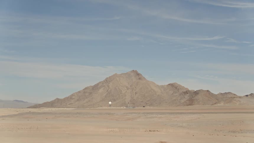 A moving shot of a desert hill