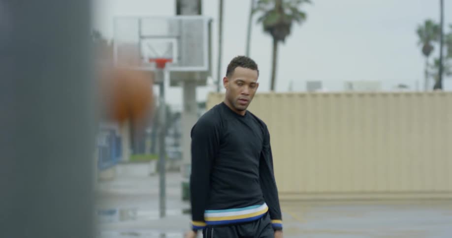A man walks up and shoots the basketball