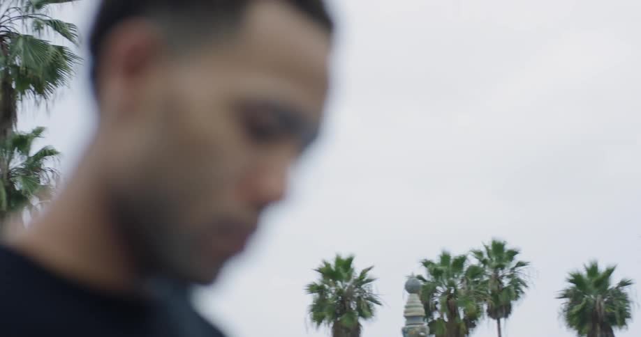 A man looking at a basketball
