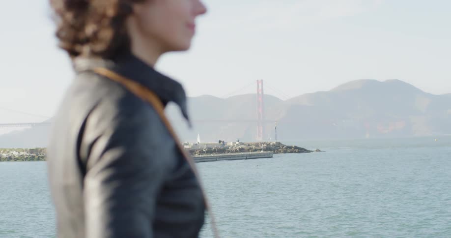 A woman looking off toward the ocean