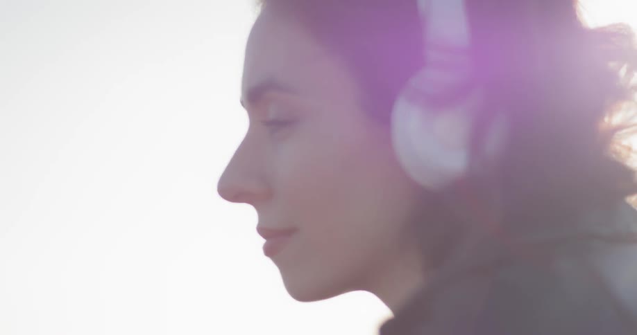 A woman listening to headphones