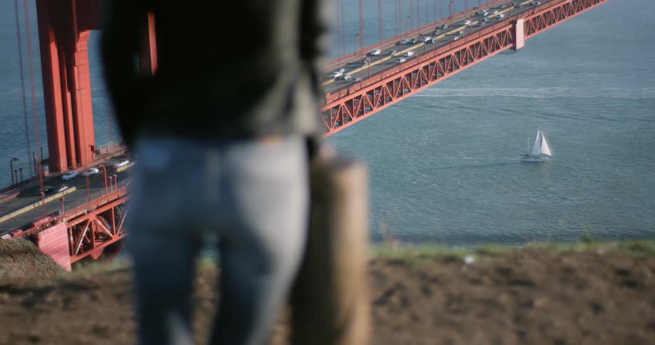 A woman looking at the golden gate bridge