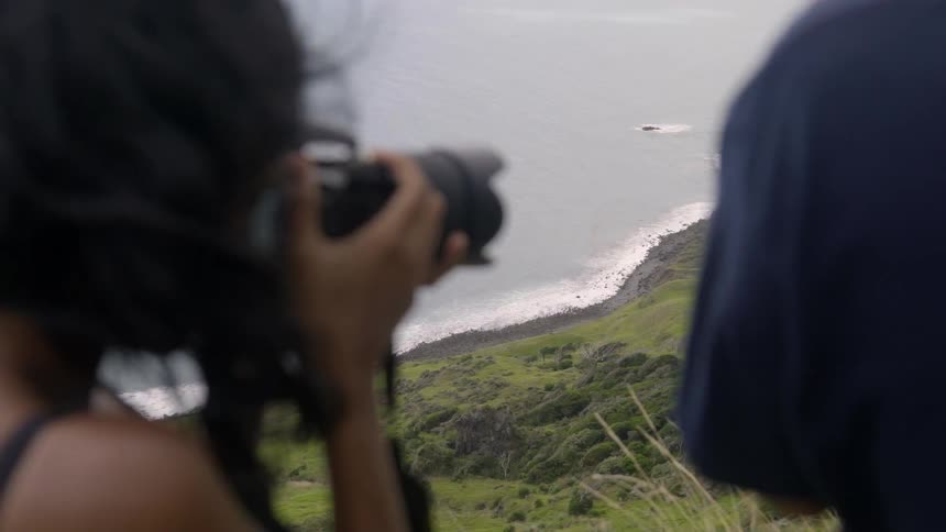 Nature Lovers Taking Pictures of Scenic Wilderness in Gentle Golden Hour.