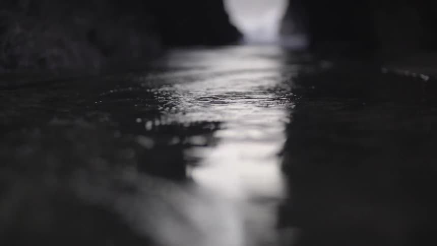 Gentle Ripples on Ocean Water Surface Under Soft Light in Calm Coastal Scene.