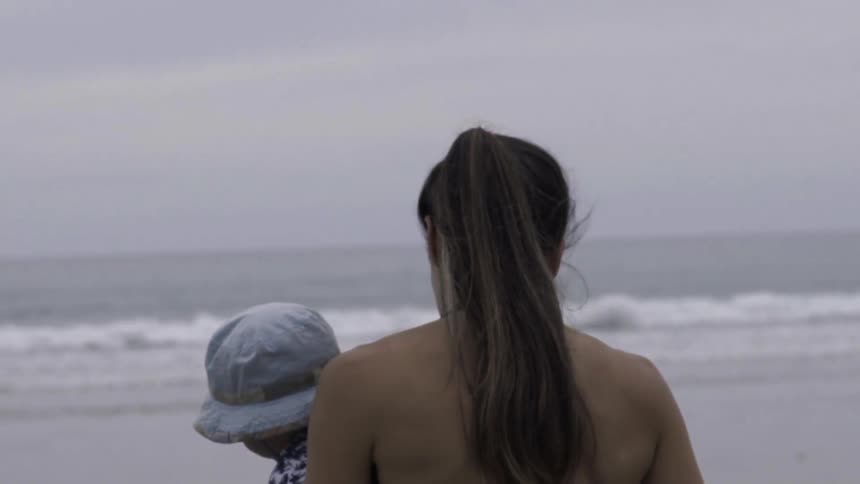 A woman is carrying a child