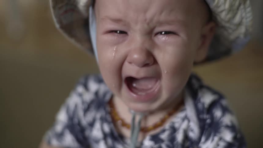 oung Child Crying, Expressing Vulnerability, Sadness, and Urgent Emotional Need.