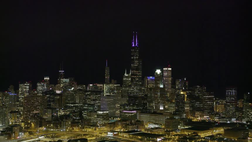 An aerial view of a downtown city at night