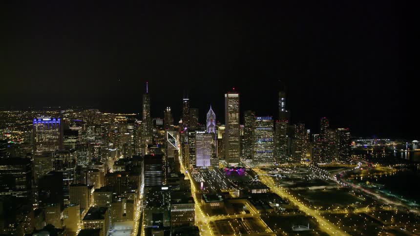An aerial view of a downtown city at night