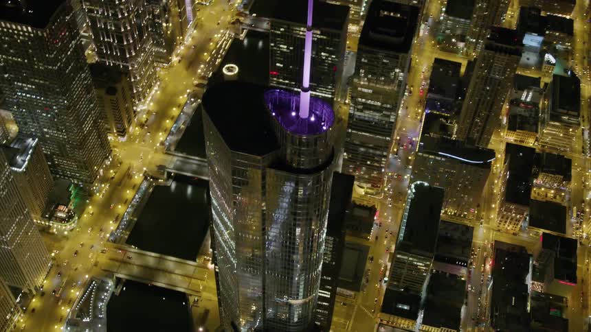 Brightly lit city streets and skyscrapers at night