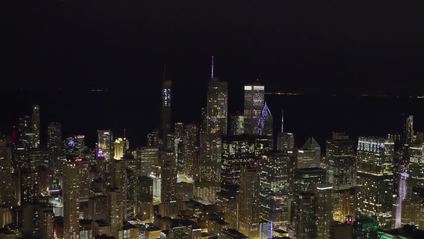 Skylineof the illuminated city with tall buildings at night