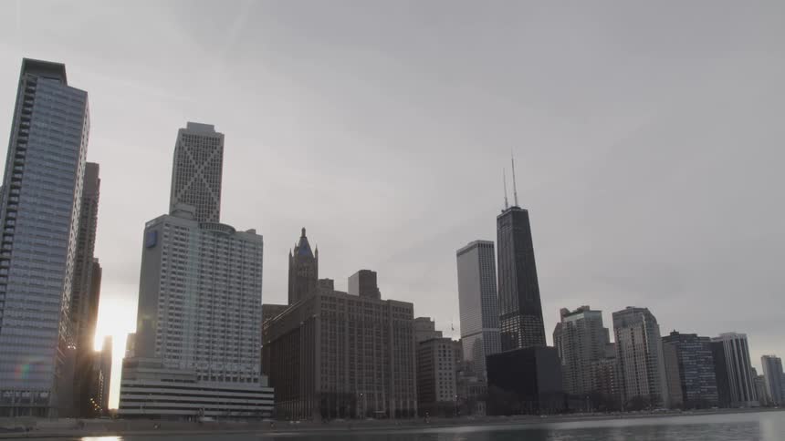 Time lapse view of waterfront skyline at sunrise