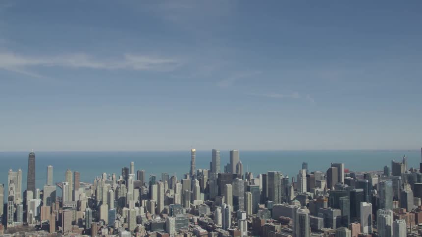 A cityscape near a large body of water