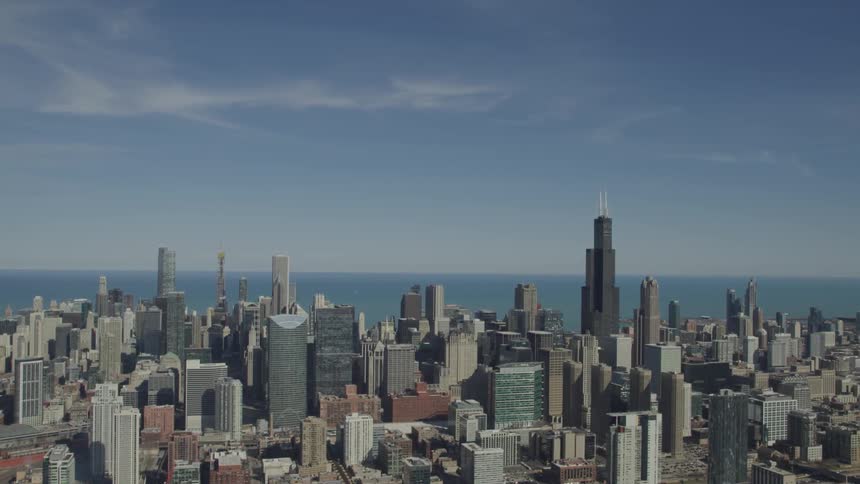 An aerial view of a downtown city is displayed