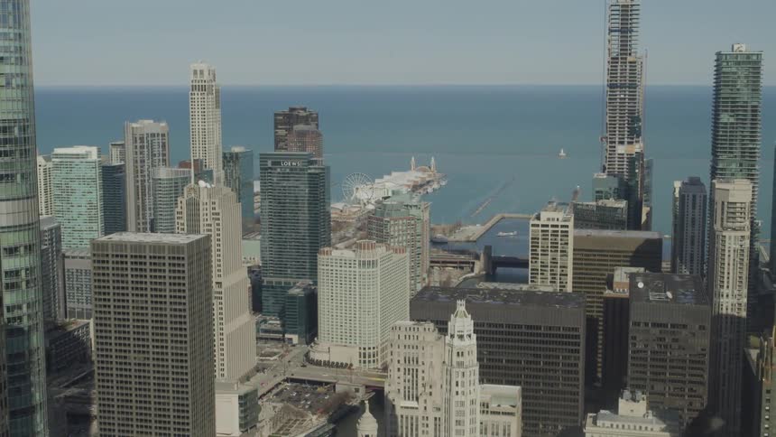 Downtown skyscrapers border ocean and docks