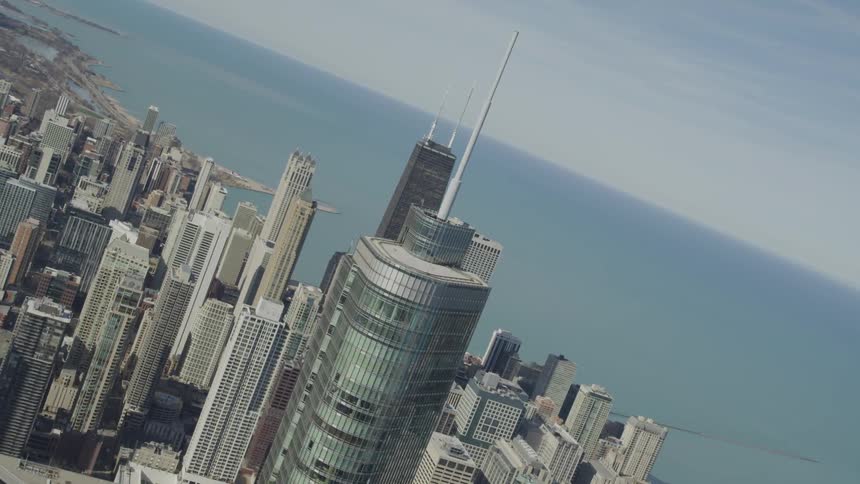 A skyscraper in a city by the sea