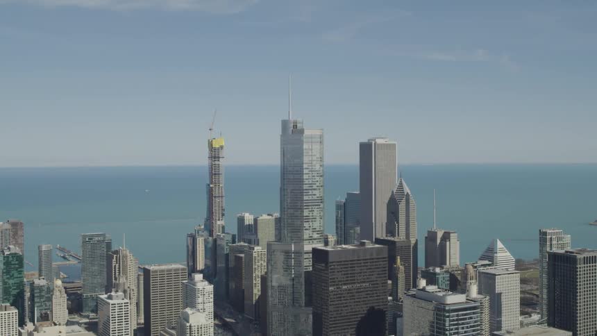 An aerial view of a downtown city is displayed