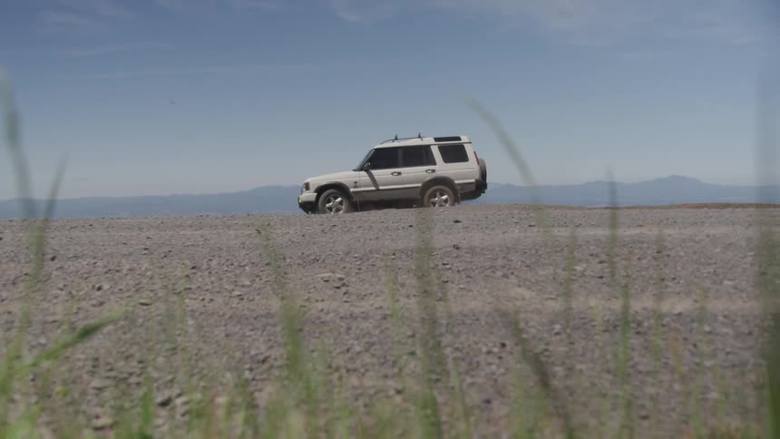 All terrain vehicle driving through dirt
