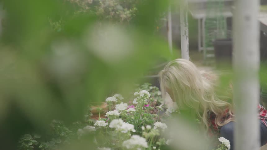 Woman tending a flower garden