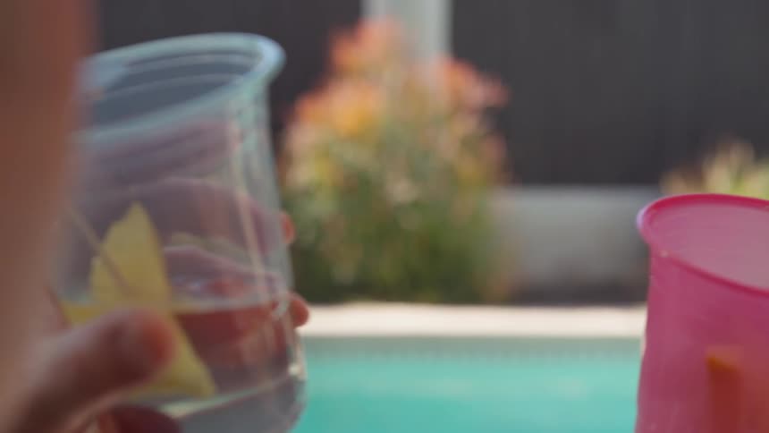 Couple enjoying couple of drinks at the pool