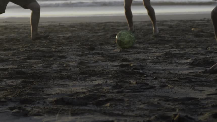 Children Joyfully Playing Soccer on Sunny Beach, Laughing, Running, and Bonding Together.