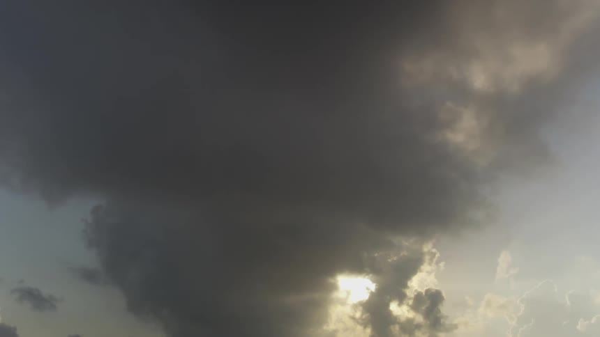 Sunlight breaks through heavy clouds