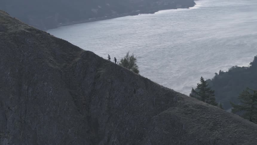 People hiking up a hill