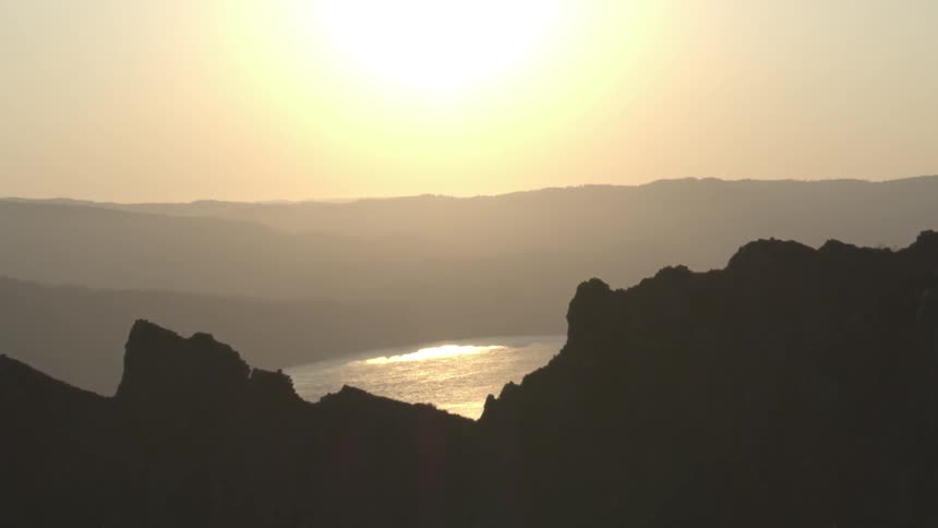 An aerial shot of a lake at dawn