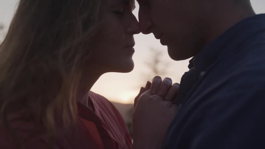 Woman and man about to kiss
