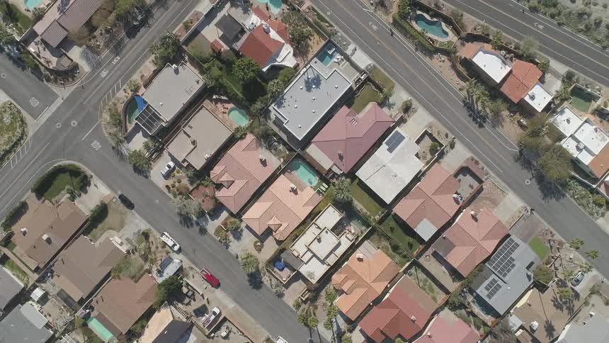An aerial view of a neighborhood is shown