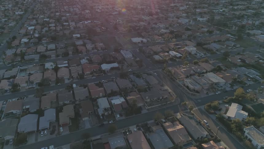An aerial view of a neighborhood is displayed