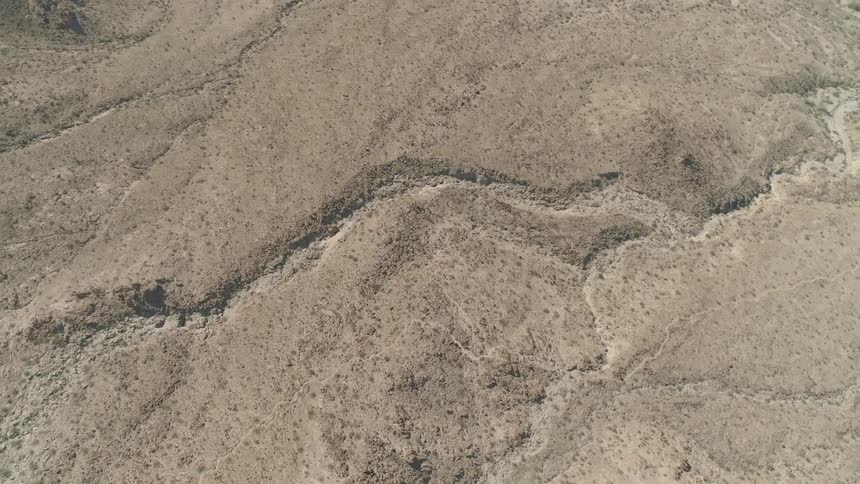 Aerial view of rough terrain on desert