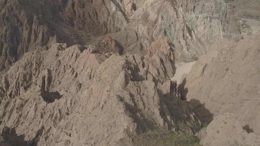 Steep cliffs with a dry valley between