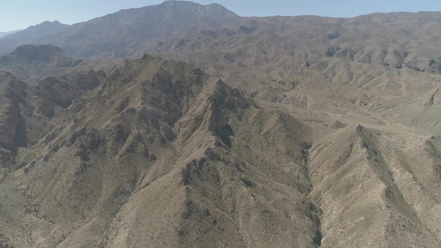 A mountain range with no vegetation during the day