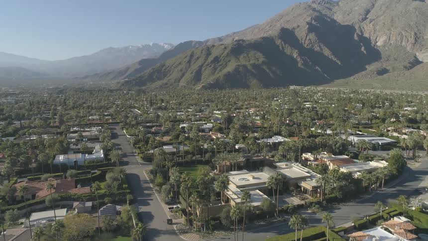 An aerial view of neighborhood near the mountain