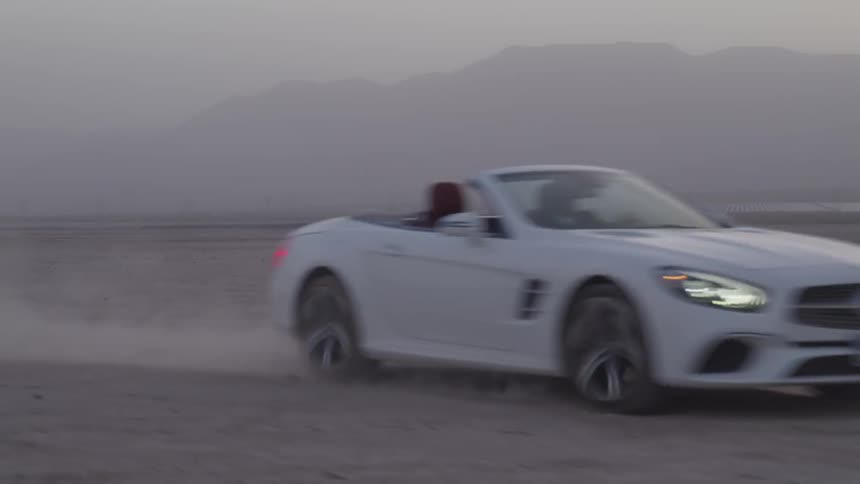 Car driving in the desert sand