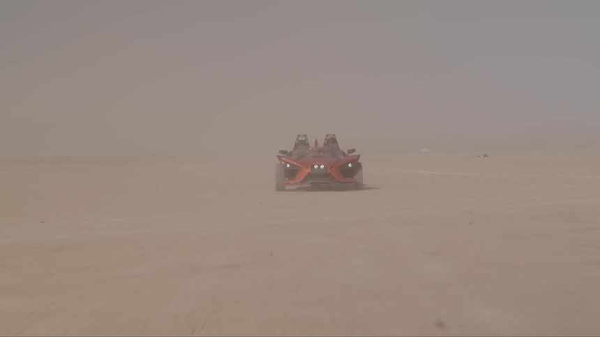 Specialty sports dune vehicle racing across desert