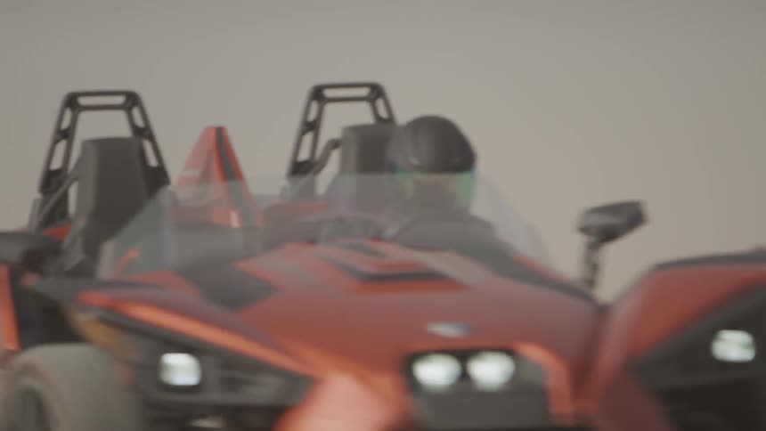 Person driving a fast dune buggy in the desert
