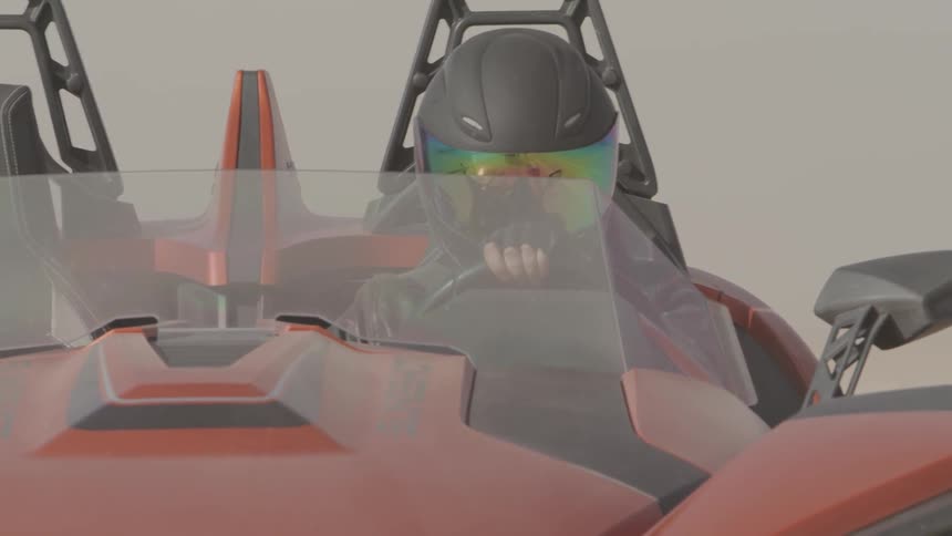 A person is wearing a helmet driving a vehicle