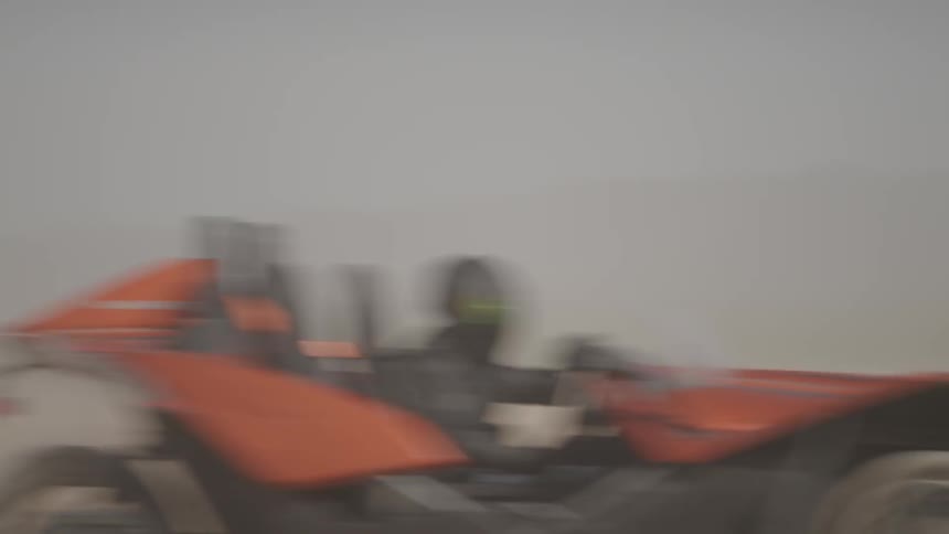 Person driving a dune buggy