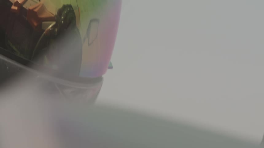 A close up of human head wears helmet