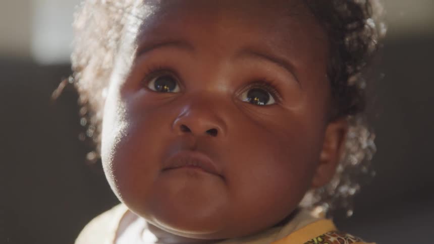 A baby bounces up and down