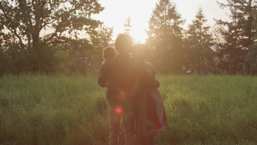 Family standing in the field