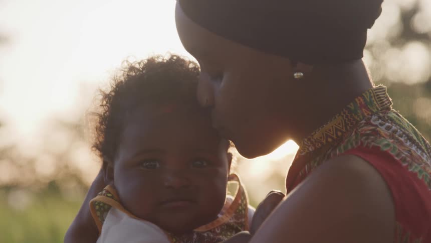 Girl holding daughter