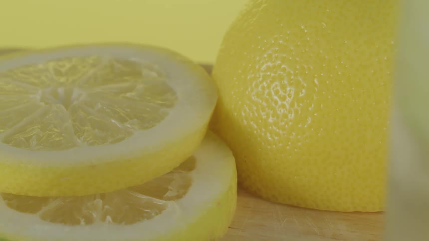 Slices of lemon sitting on a cutting board